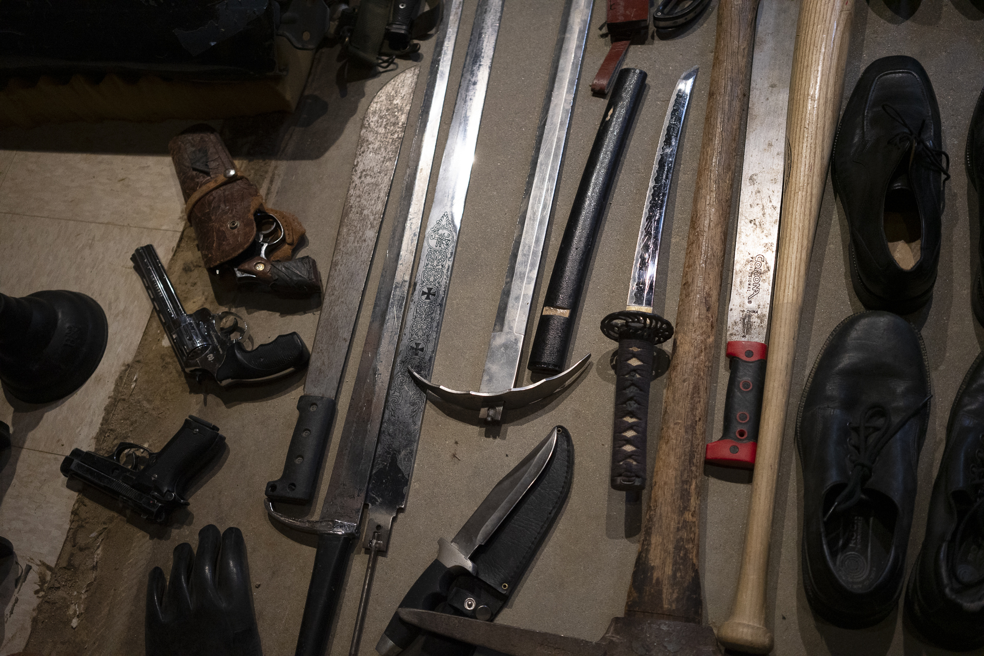 Sword and blade props racked on the wall of The Foley Job stage