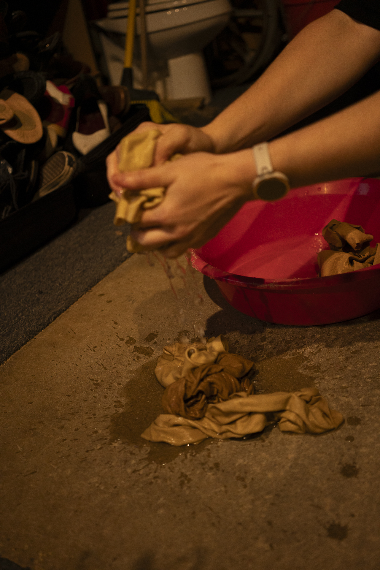 Hands working surface textures in the Foley pit