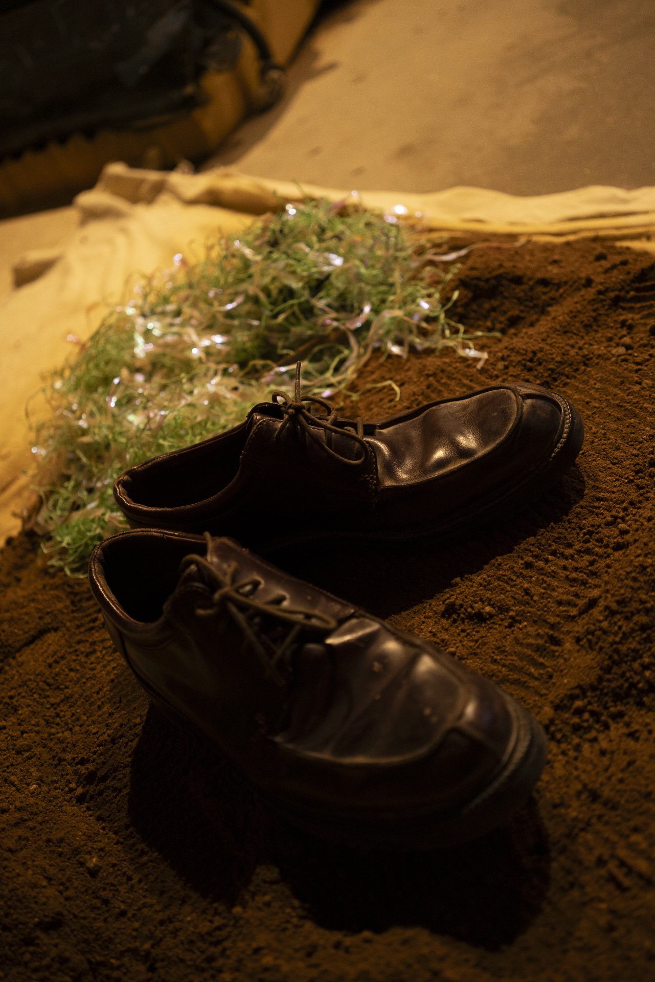 Boots in a dirt pit for footstep Foley recording
